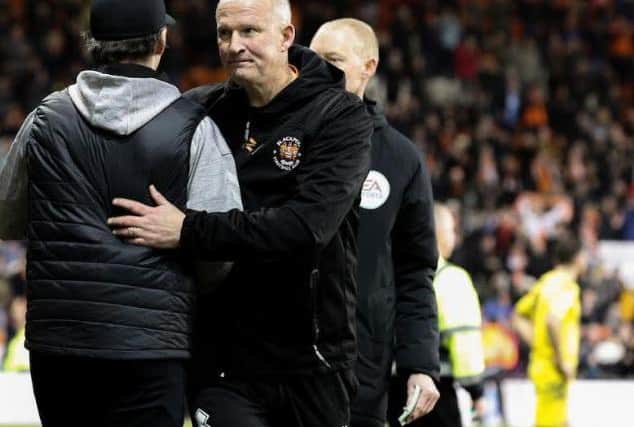 Blackpool boss Simon Grayson stops a fan