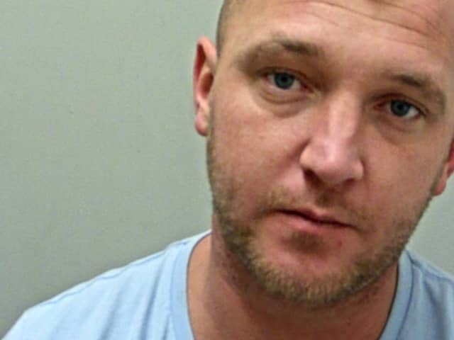 Kurt Baxter is wanted in connection with an investigation into a report of fraud (Credit: Lancashire Police)