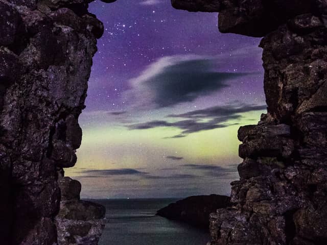 The northern lights captured through a wndow at Duntulm Castle in the north of Skye