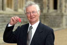 Dr. Frank Duckworth poses after he was made a Member of the British Empire 