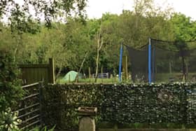 Catherine Webb says the campsite behind her home is ruining the quiet retreat she wanted when she moved; the neighbours say they are just tryng to run a business.