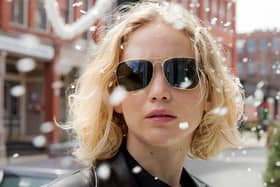 Jennifer Lawrence wearing gold-framed aviators in the movie Joy