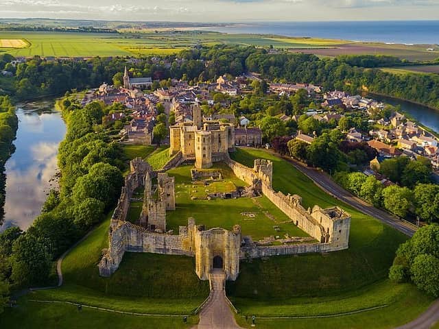 A view over Warkworth Castle and the surrounding village which has topped the list of British villages which have risen in value for 20 years straight.