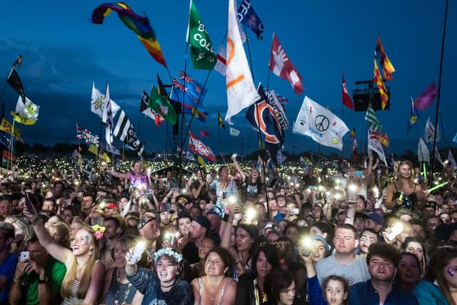 PILTON, ENGLAND - JUNE 25:  The crowd enjoys the atmosphere as Ed Sheeran headlines on the Pyramid Stage during day 4 of the Glastonbury Festival 2017 at Worthy Farm, Pilton on June 25, 2017 in Glastonbury, England.  (Photo by Ian Gavan/Getty Images)