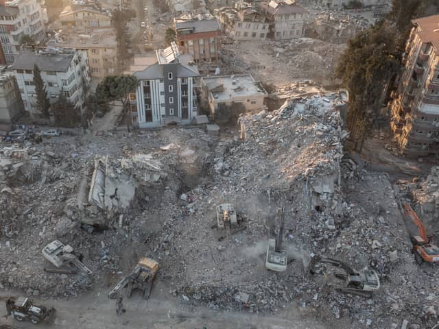 An aerial view of work machines and diggers at the site of collapsed buildings on February 16, 2023 in Hatay, Turkey