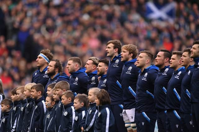 The Scotland team sing the national anthem during a Six Nations Rugby match at Murrayfield Stadium