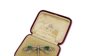 This emerald and diamond dragonfly brooch worn at three royal coronations has gone up for sale at Mayfair’s oldest family jewellers for £350,000.