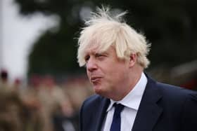 UK prime minister Boris Johnson meets with military personnel who worked on the Afghan evacuation during a visit to Merville Barracks on September 2