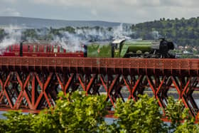 Flying Scotsman passes over the Forth Bridge as part of a series of events to celebrate her centenary. The world famous steam locomotive left Edinburgh before heading north to Aberdeen. 