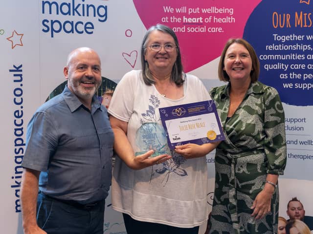 Julie Rose Neale collecting her award from charity Making Space.
