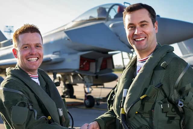 Flt Lt Matt Brighty, right, shakes hands with 2022 Typhoon Display Pilot 'Paddy' O'Hare ahead of Blackpool Airshow 2023