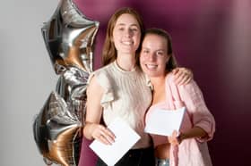 Bella Mollart and Mollie McNicholas collect their A Level results at AKS
