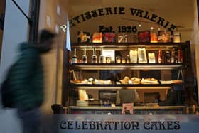 A pedestrian walks past a branch of a Patisserie Valerie cafe in London on January 23, 2019.