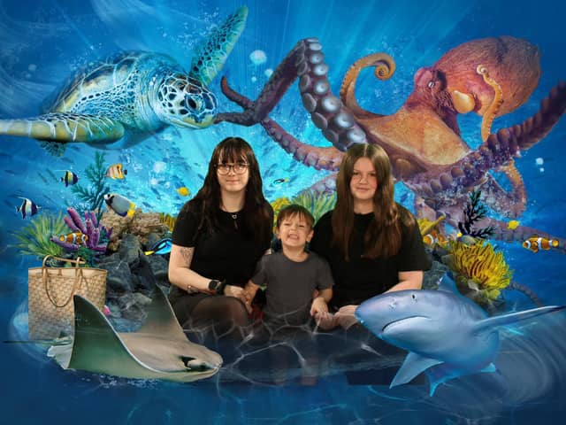 Leah Peachey, who won a Blackpool Big Ticket, donated by Blackpool-based business Evolution,pictured with three-year-old brother Oscar, and 13-year-old stepsister Daisyat SEA LIFE Blackpool.