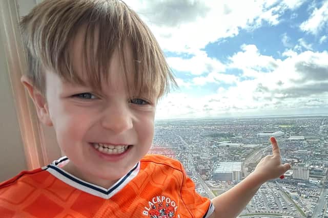 Oscar at the top of Blackpool Tower, pointing out where his favouritefootball team Blackpool FC play at Bloomfield Road,
