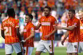 Former Blackpool defender Clark Robertson, centre