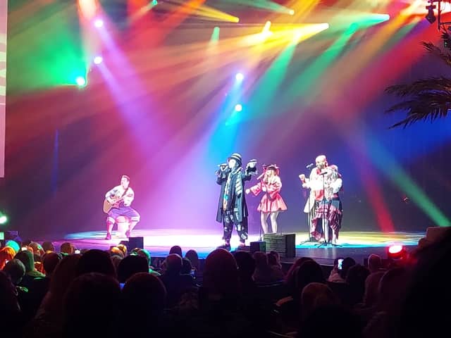 Boy George performs boy Karma Chameleon on stage at Blackpool Winter Gardens in Peter Pan