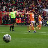 Referee Ben Atkinson has Sonny Carey in a state of disbelief during Blackpool’s game against Peterborough on Satruday
