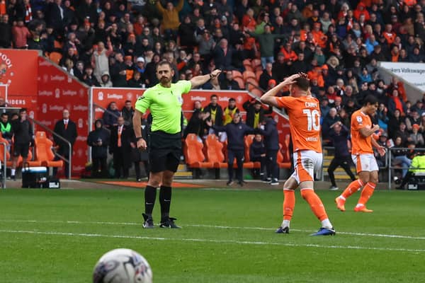 Referee Ben Atkinson has Sonny Carey in a state of disbelief during Blackpool’s game against Peterborough on Satruday