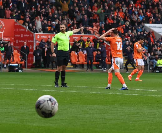 Referee Ben Atkinson has Sonny Carey in a state of disbelief during Blackpool’s game against Peterborough on Satruday