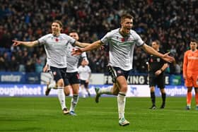 George Thomason celebrates scoring the only goal of the game as Bolton claimed a 1-0 win against Blackpool.