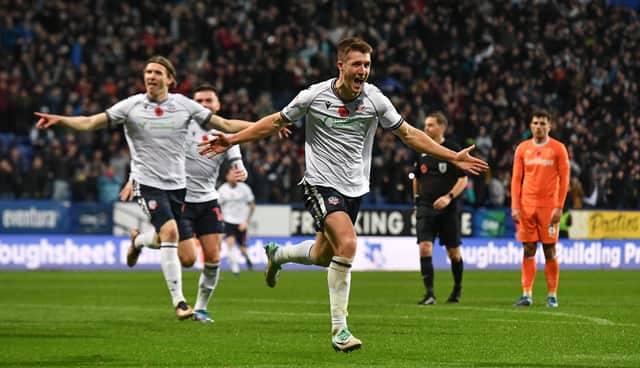 George Thomason celebrates scoring the only goal of the game as Bolton claimed a 1-0 win against Blackpool.
