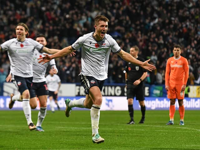 Former Blackpool youngster George Thomason celebrates his winner against the Seasiders