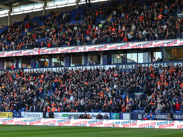 A general view of Blackpool fans at Bolton as they fill the two tiers. 