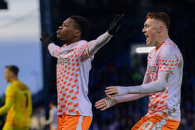 Karamoko Dembélé celebrates Blackpool's second goal in their 4-0 win against Portsmouth at Fratton Park.