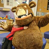 The Gruffalo poses with a sick child during a visit to Blackpool Victoria Hospital