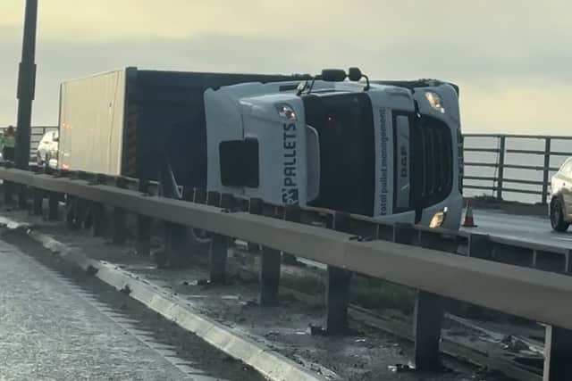 The lorry was travelling clockwise around the motorway when it overturned on Barton Bridge at around 8.15am this morning (Thursday, December 21).
