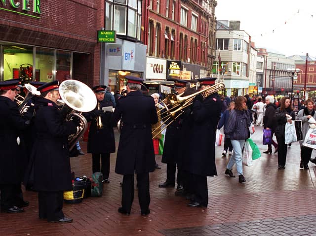 The Salvation Army brass band blast out a few tunes to get Christmas shoppers in to th e festive spirit in Blackpool