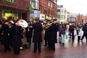 The Salvation Army brass band blast out a few tunes to get Christmas shoppers in to th e festive spirit in Blackpool
