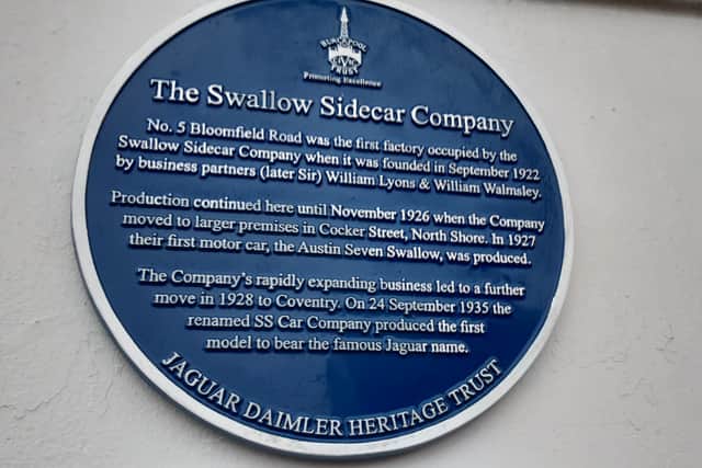 A blue plaque commemorating Swallow Sidecars