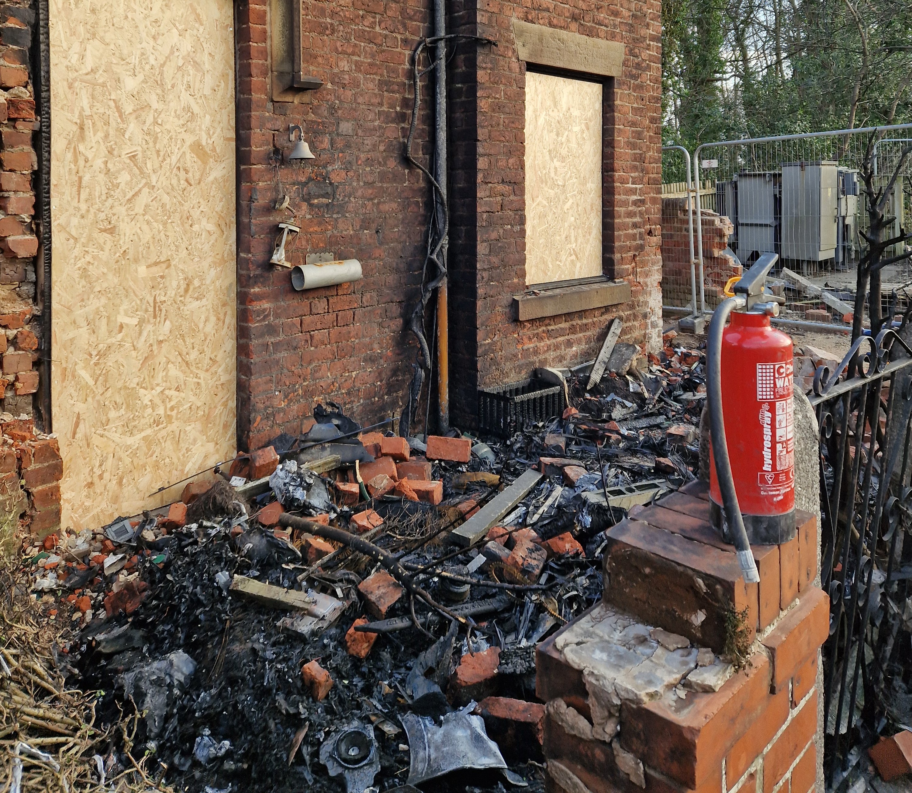 Two arrested after £100k car crashes into house and bursts into flames