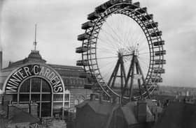 The Great Wheel 1890-1910. A view across the rooftops towards the Great Wheel beside the Winter Gardens in Blackpool. The wheel was erected at the end of the 19th century on the corner of Adelaide Street and Coronation Street