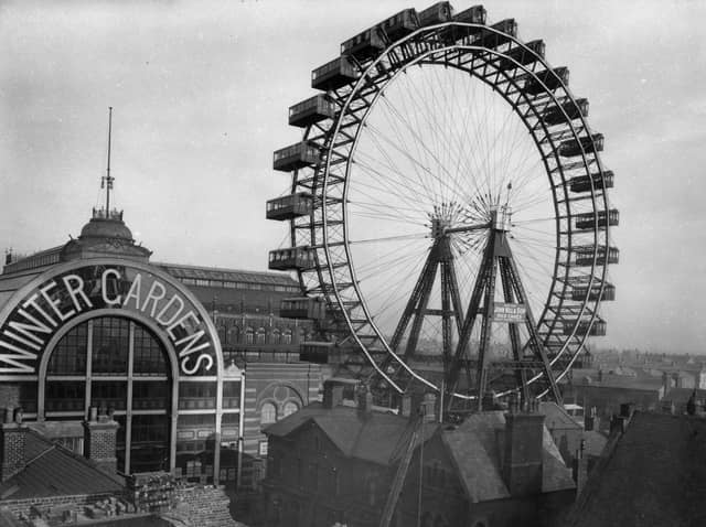 The Great Wheel 1890-1910. A view across the rooftops towards the Great Wheel beside the Winter Gardens in Blackpool. The wheel was erected at the end of the 19th century on the corner of Adelaide Street and Coronation Street