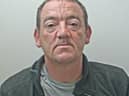 Barry Nelson is wanted for assault occasioning actual bodily harm, harassment and stalking (Credit: Lancashire Police)