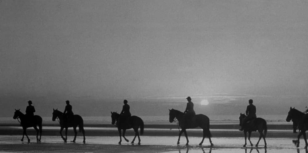circa 1937:  Horse riders on Blackpool beach, silhouetted against the evening sky.  (Photo by Fox Photos/Getty Images)