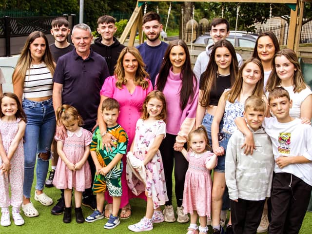 Sue and Noel Radford with eighteen of their children.