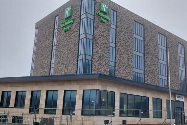 The Holiday Inn is among projects funded through borrowing