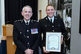 PC Marc Saysell saved a young boy's life after they fell into a pond (Credit: Lancashire Police)