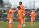 Blackpool's Karamoko Dembele celebrates with Kyle Joseph after scoring against Bristol Rovers. (Image: CameraSport - Ian Cook).