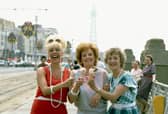 Coronation Street: 1985
Bet Lynch (Julie Goodyear), Rita Fairclough ( Barbara Knox) and Mavis Riley (Thelma Barlow in Blackpool eating ice-cream.