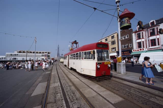 A tram makes it way along the seafront of the seaside resort of Blackpool, Lancashire, August 1983