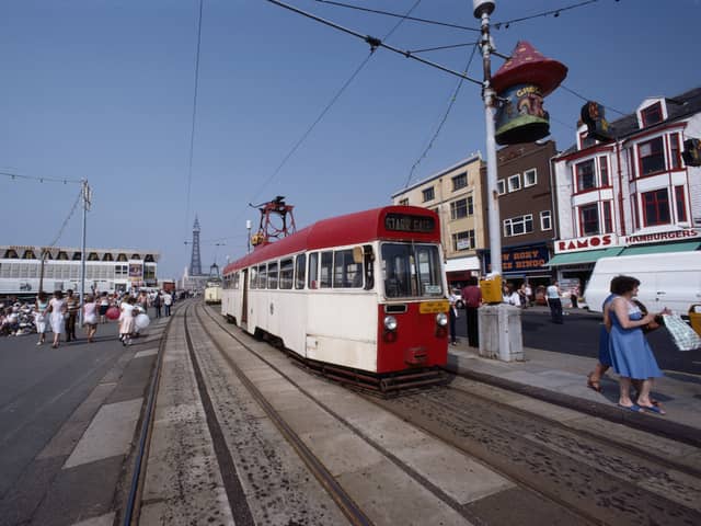 A tram makes it way along the seafront of the seaside resort of Blackpool, Lancashire, August 1983