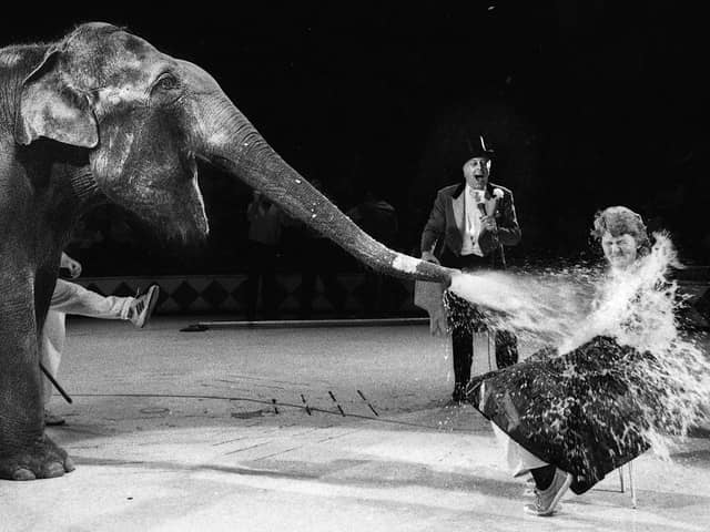 Teacher Laura Turner is sprayed with gallons of water by Alexandra the elephant at Blackpool Tower Circus for a special wash and shampoo session on Wednesday 25th of October 1989 