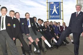 Best foot forward.  Education Director from Blackpool Dr David Sanders and School Children from the Blackpool area in front of the Excellence sign on the promonade.