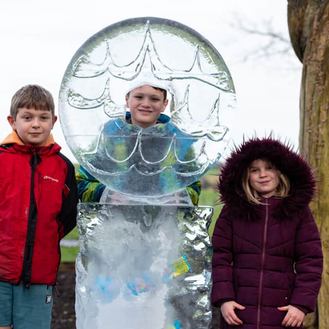 Luis, Ollie and Tehya-Mae with the biscuit ice sculpture at Fylde Ice Festival in Kirkham. Photo: Kelvin Lister-Stuttard