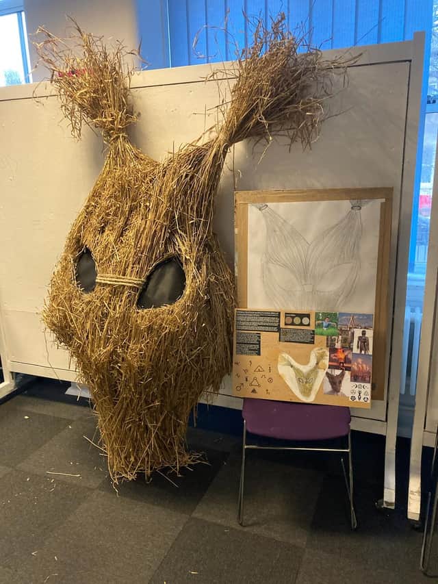 straw mask made by art students was hanging in the Blackpool Grand foyer